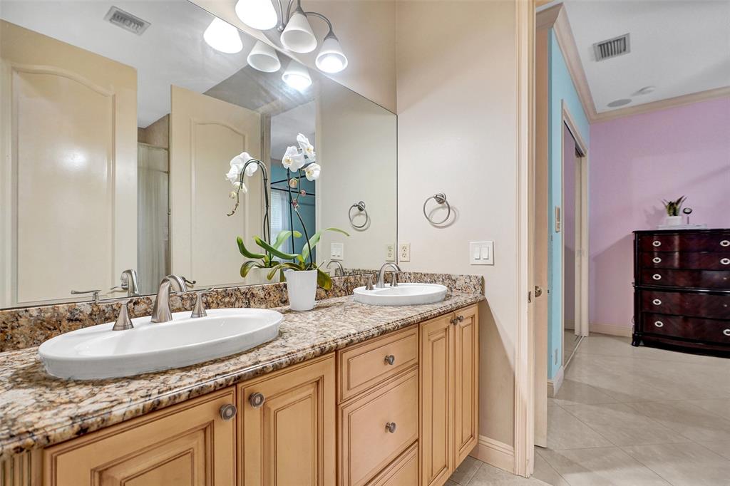 8426 Sawpine Road Delray Beach, FL 33446 - Photo 62 of 91 a bathroom with a granite countertop sink and a mirror