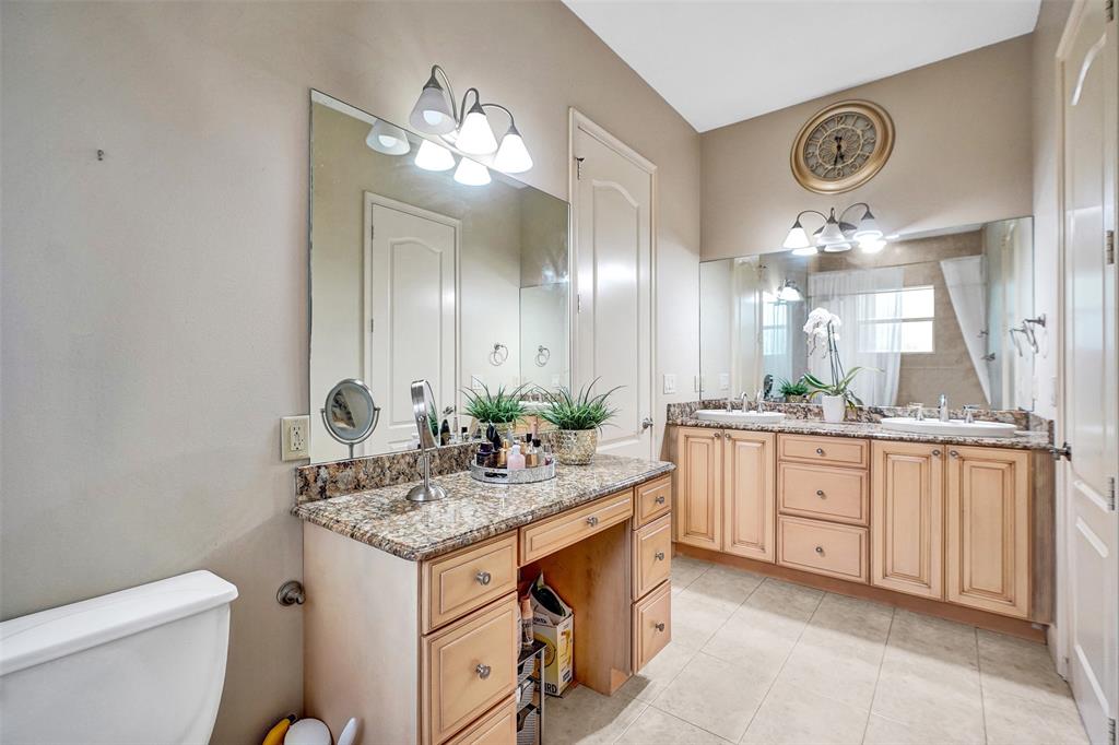 8426 Sawpine Road Delray Beach, FL 33446 - Photo 66 of 91 a bathroom with a sink a vanity and a mirror