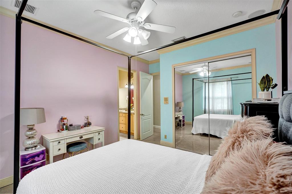 8426 Sawpine Road Delray Beach, FL 33446 - Photo 69 of 91 a bedroom with a bed and a chandelier