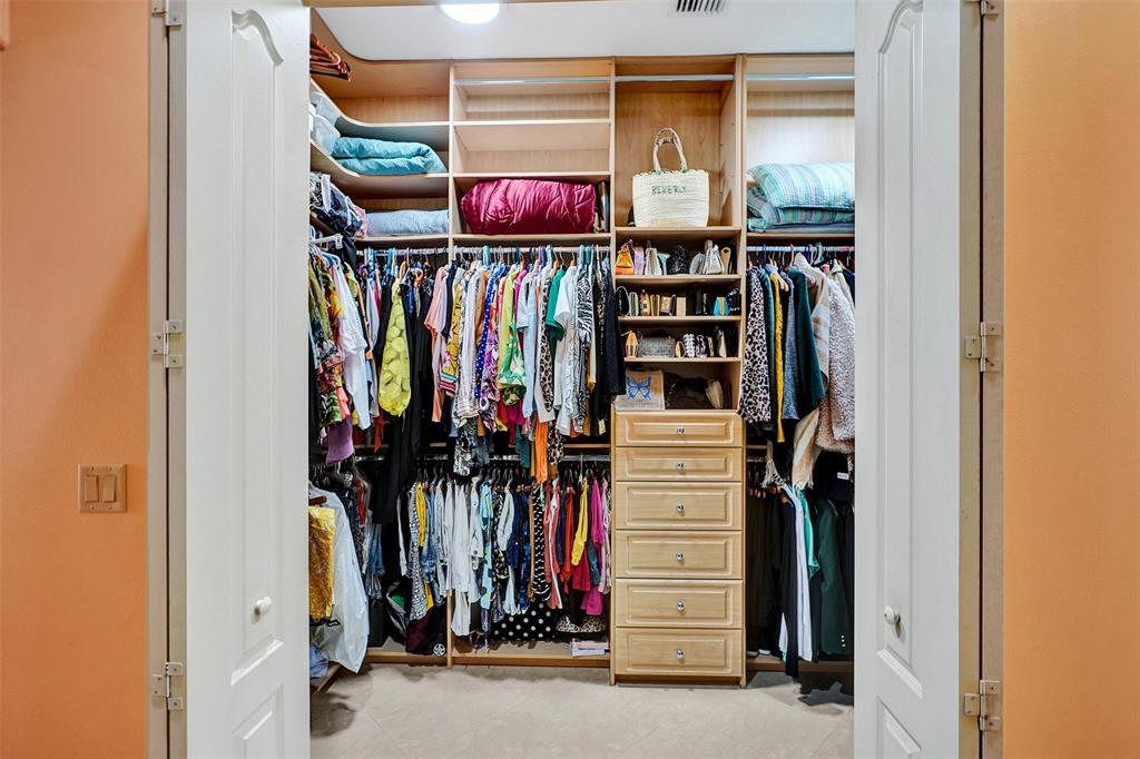 8426 Sawpine Road Delray Beach, FL 33446 - Photo 82 of 91 a view of walk in closet with clothes