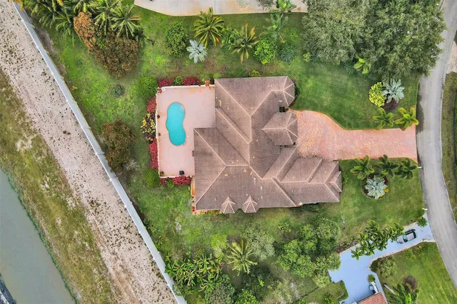 an aerial view of house with yard