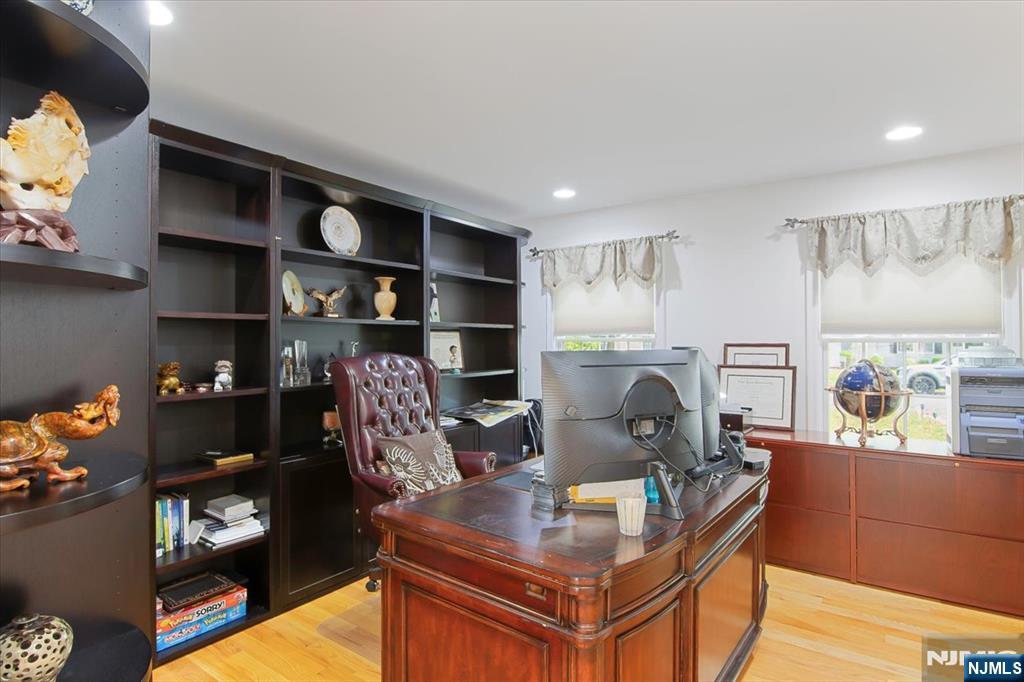 85 Harvey Avenue Paramus, NJ 07652 - Photo 12 of 32 a living room with furniture and a fireplace