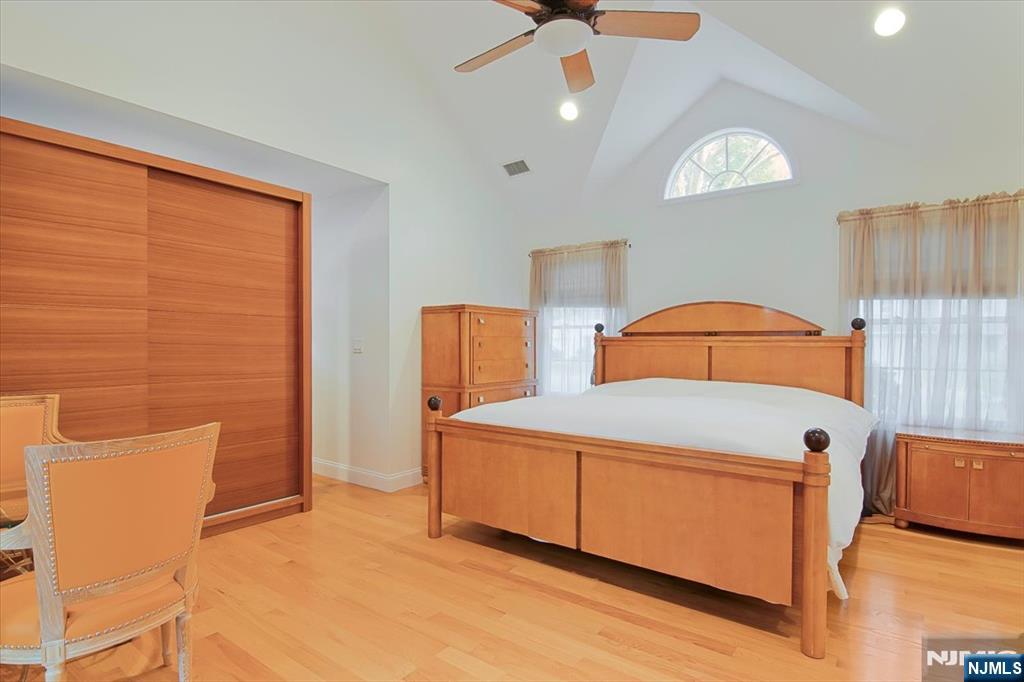 85 Harvey Avenue Paramus, NJ 07652 - Photo 13 of 32 a bedroom with a bed and a window