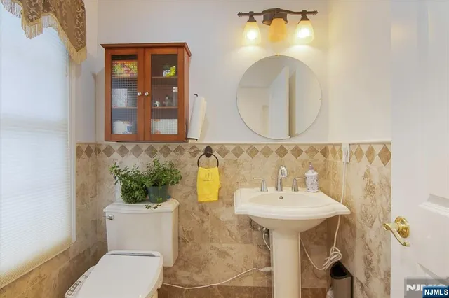 a bathroom with a sink a mirror and a shower