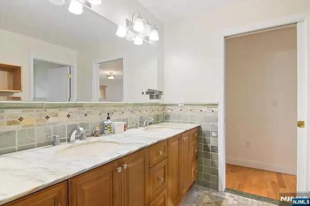 a bathroom with a sink and shower