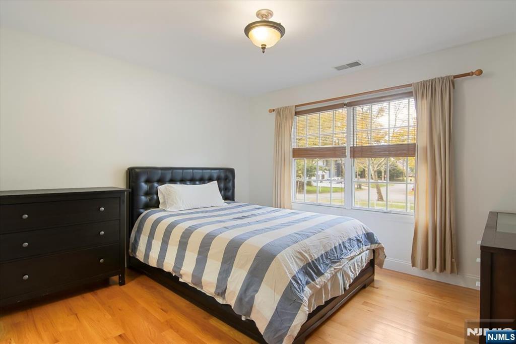 85 Harvey Avenue Paramus, NJ 07652 - Photo 22 of 32 a bedroom with a bed and window