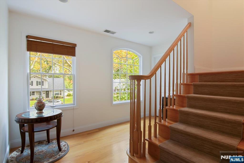 85 Harvey Avenue Paramus, NJ 07652 - Photo 27 of 32 a view of entryway and hall with wooden floor
