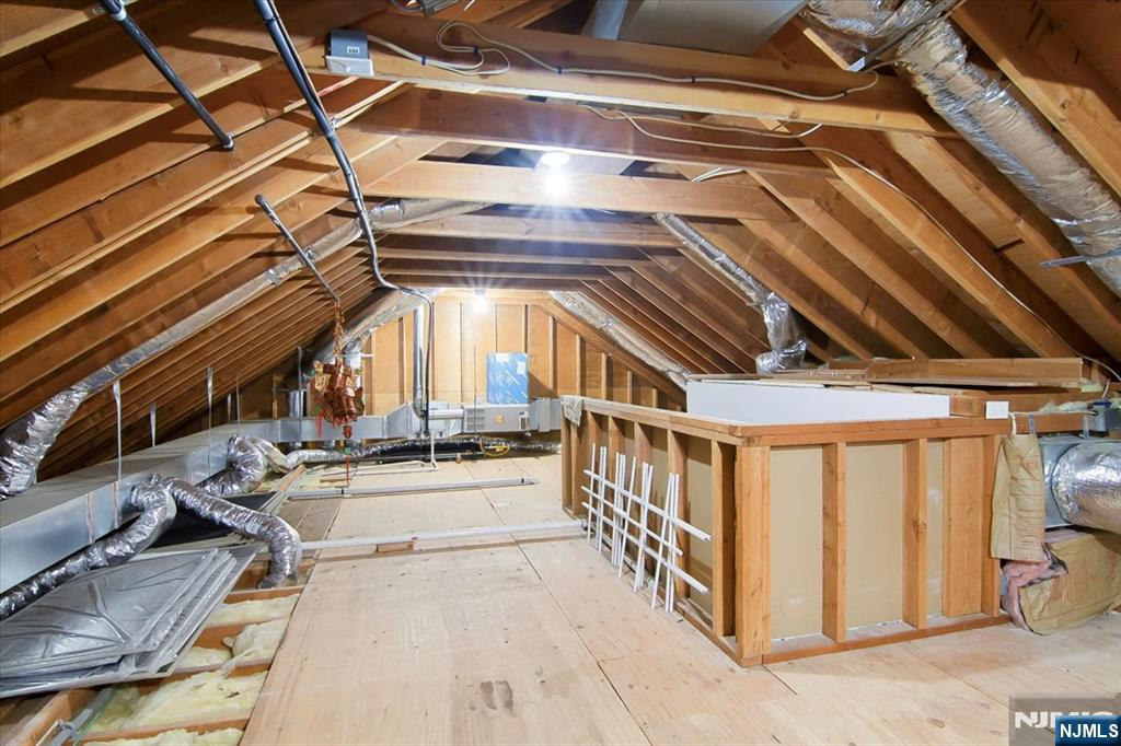 85 Harvey Avenue Paramus, NJ 07652 - Photo 29 of 32 a view of an empty room with wooden floor