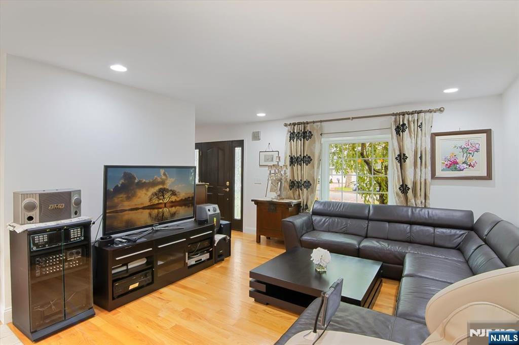 85 Harvey Avenue Paramus, NJ 07652 - Photo 4 of 32 a living room with furniture and a flat screen tv