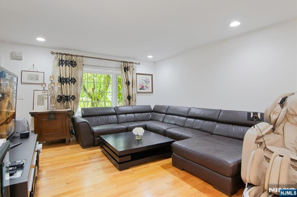 85 Harvey Avenue Paramus, NJ 07652 - Photo 5 of 32 a living room with furniture and a large window