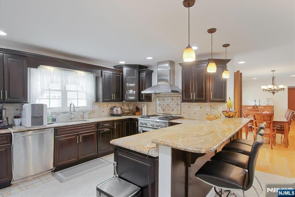 85 Harvey Avenue Paramus, NJ 07652 - Photo 7 of 32 a kitchen with lots of counter space sink and appliances