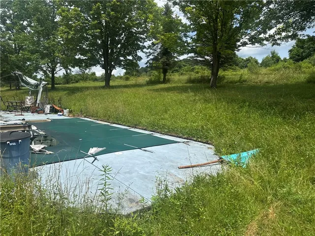 a view of a lake with a yard