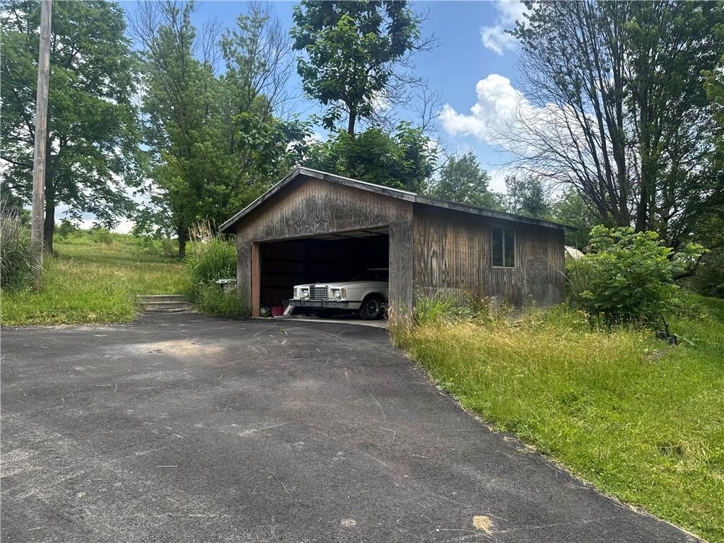 218 Hatfield Road Smock, PA 15480 - Photo 2 of 15 a front view of a house with garden