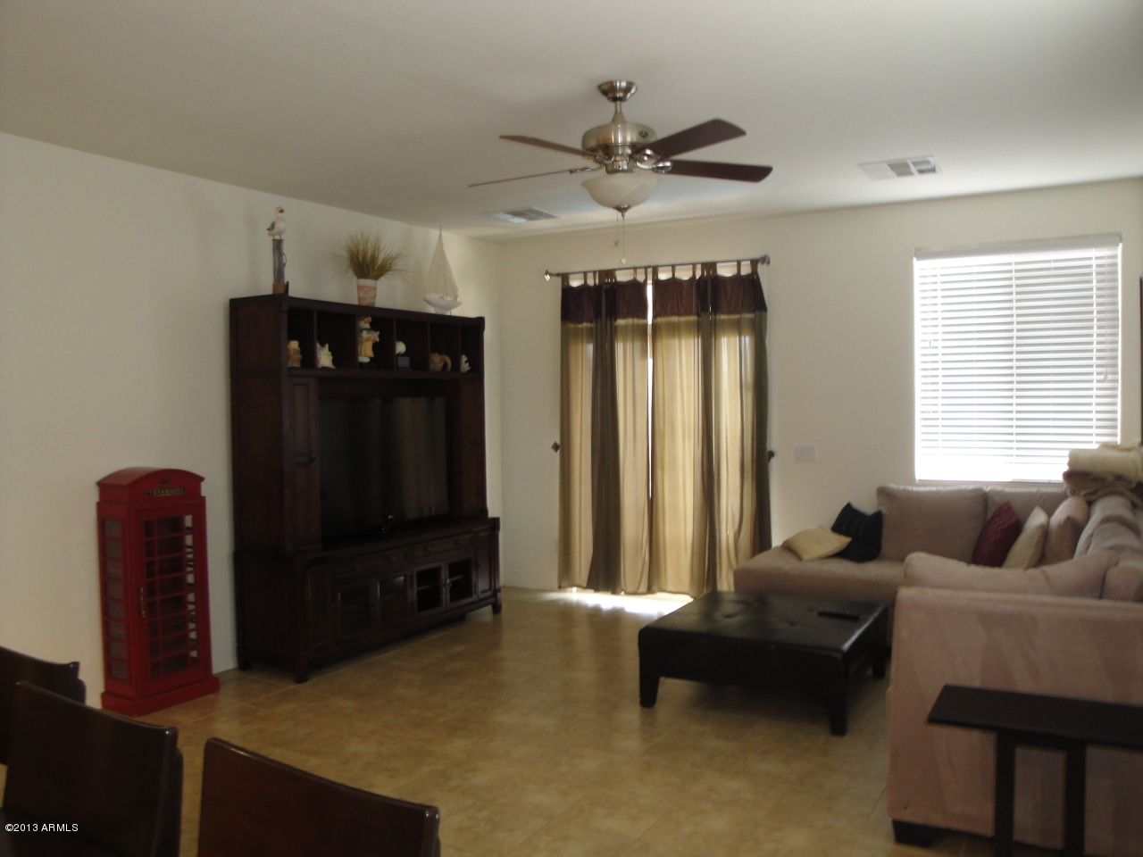 7346 West Carter Road Laveen, AZ 85339 - Photo 12 of 42 a living room with furniture and a flat screen tv