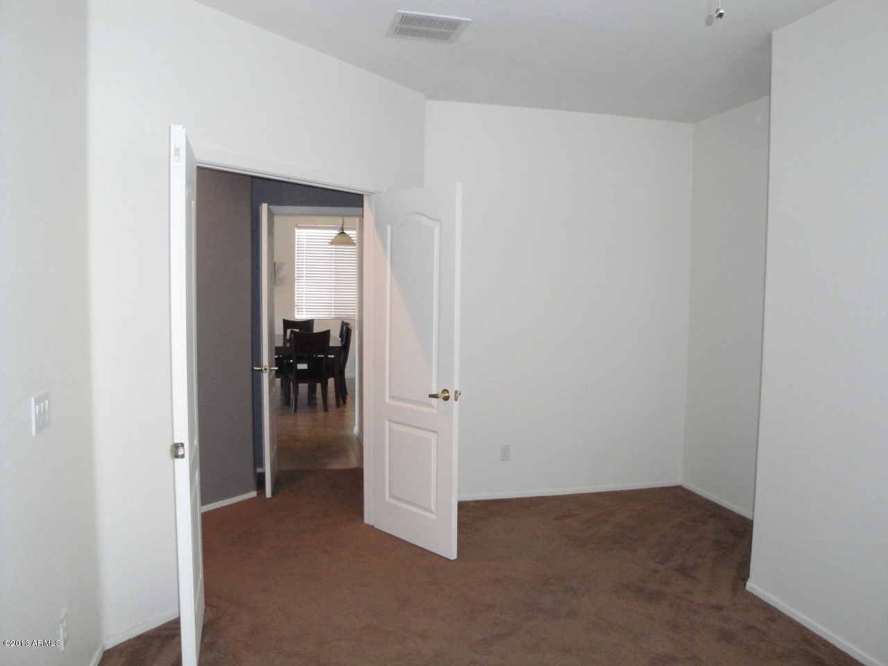 7346 West Carter Road Laveen, AZ 85339 - Photo 14 of 42 a view of a livingroom from a hallway