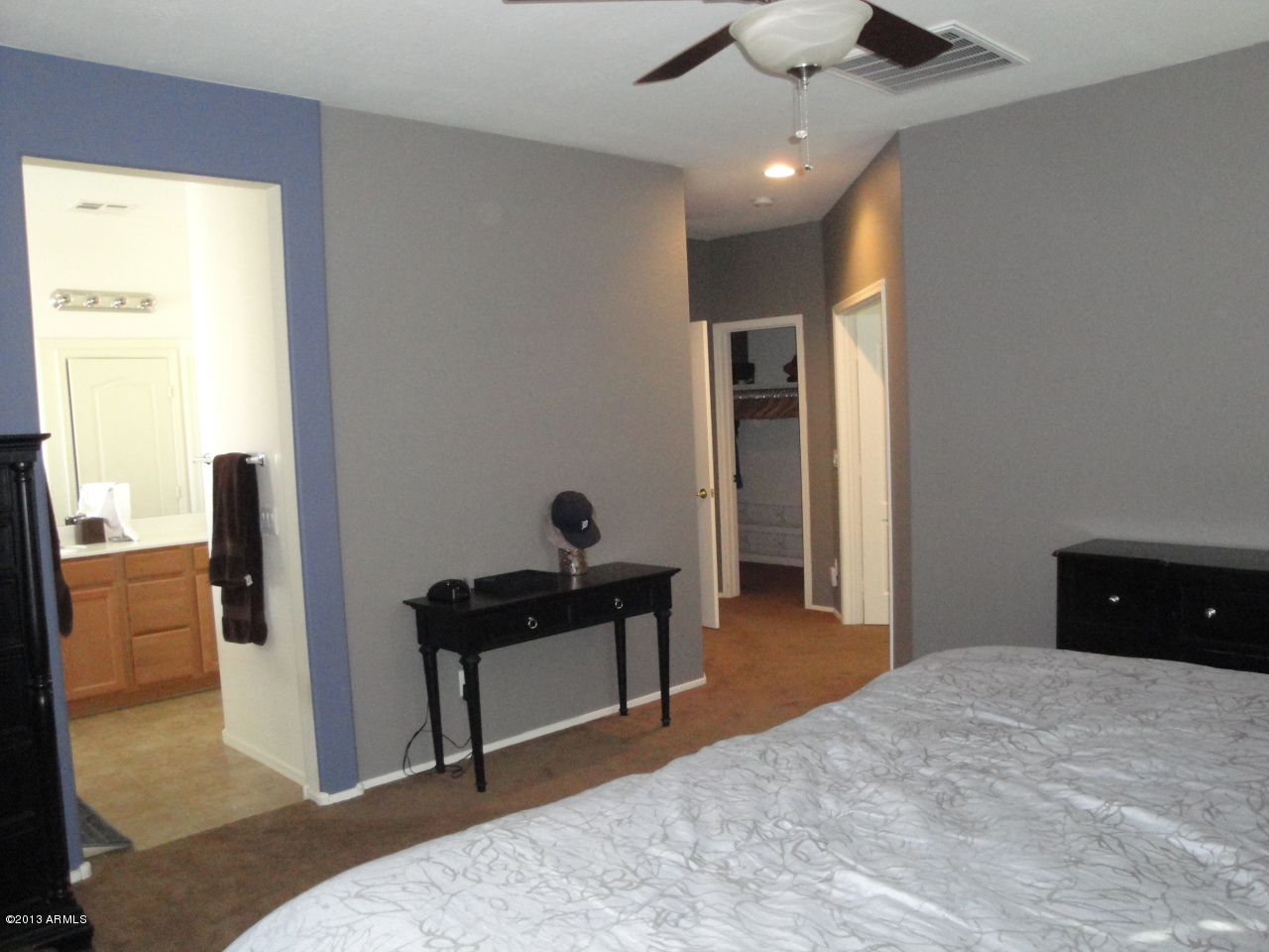 7346 West Carter Road Laveen, AZ 85339 - Photo 15 of 42 a bedroom with a bed and a dresser
