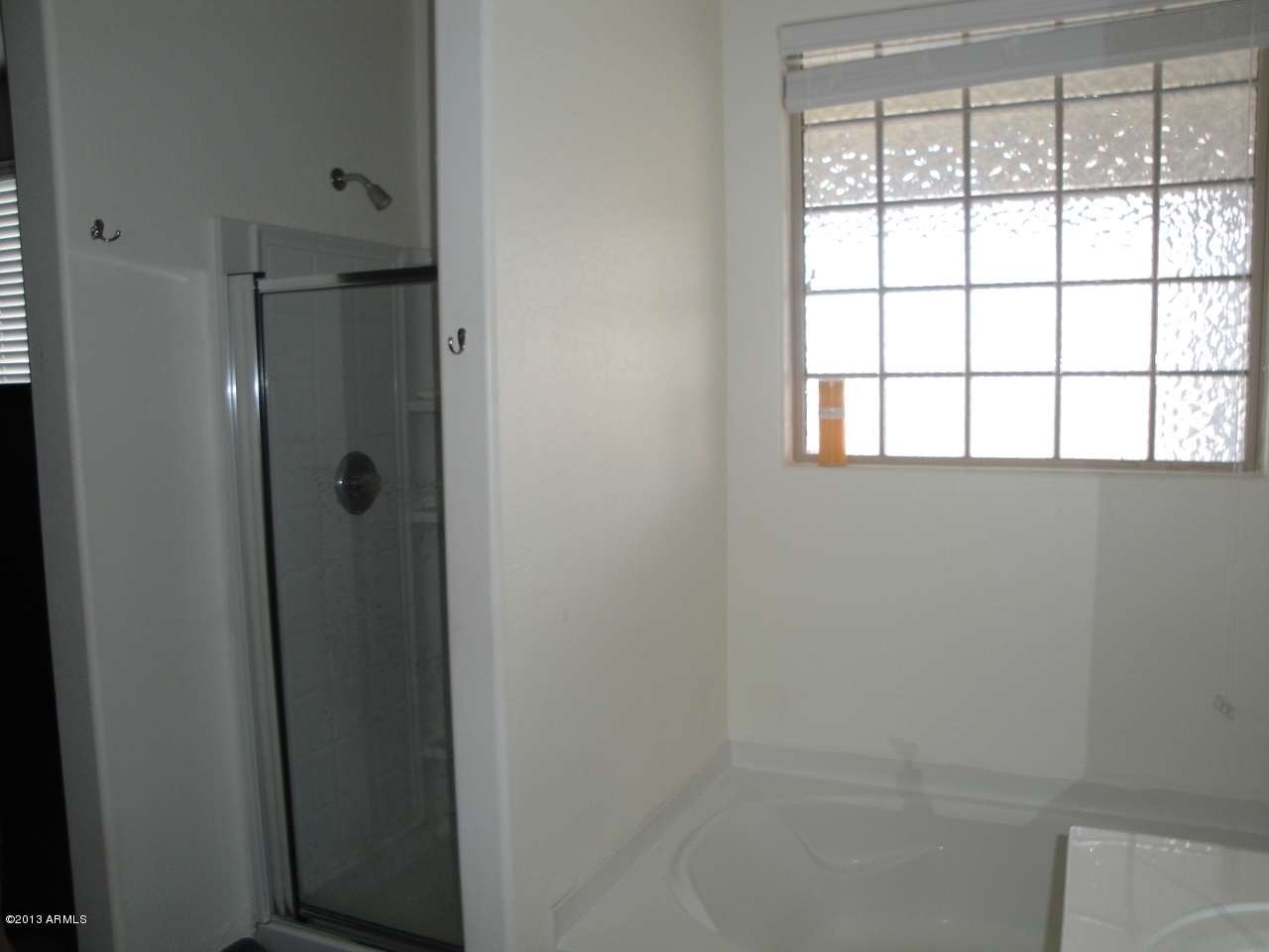 7346 West Carter Road Laveen, AZ 85339 - Photo 18 of 42 a bathroom with a shower