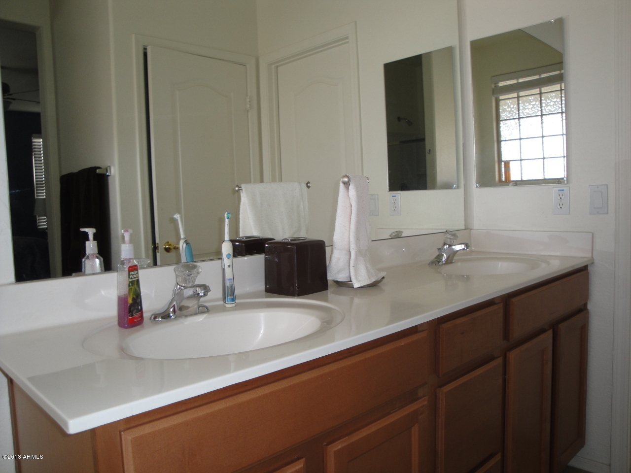 7346 West Carter Road Laveen, AZ 85339 - Photo 19 of 42 a bathroom with a sink and a mirror