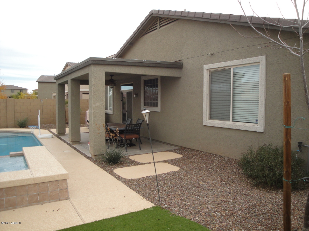 7346 West Carter Road Laveen, AZ 85339 - Photo 36 of 42 a view of house and a yard with a fountain