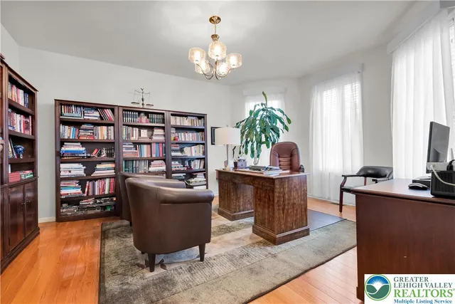 a bedroom with a bed chair and a window