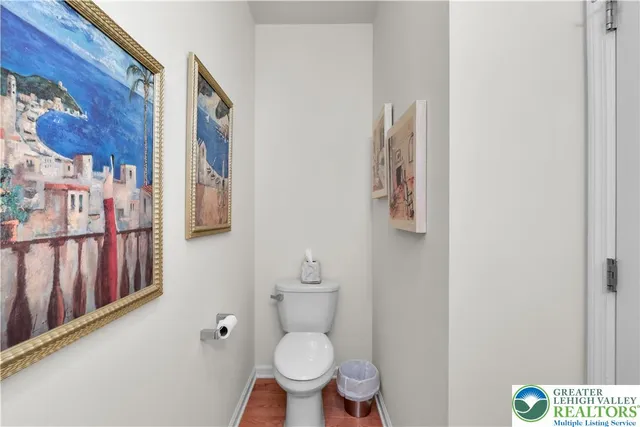 a spacious bathroom with a granite countertop double vanity sink a mirror a bathtub and shower