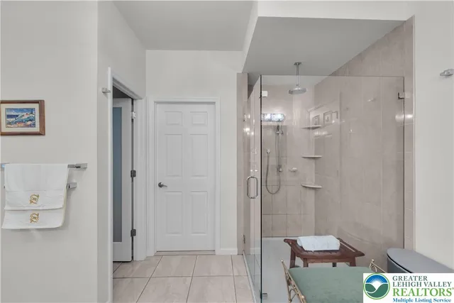 a bath room with a bath tub and a shower