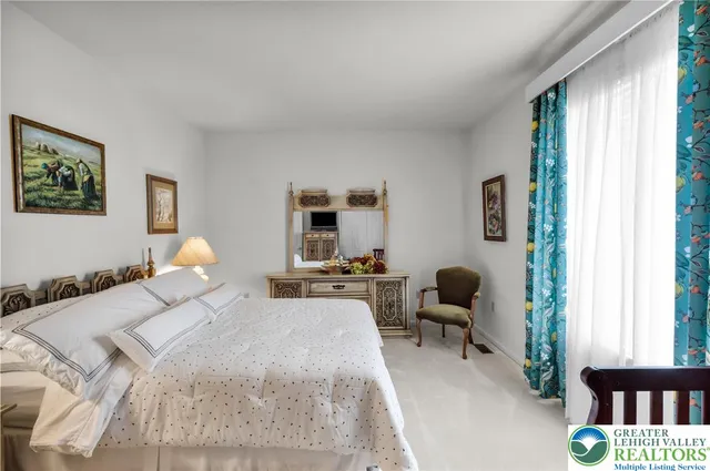 a view of a patio with table and chairs floor to ceiling window with wooden floor