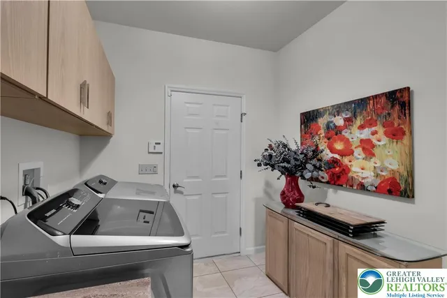 an aerial view of a house with yard