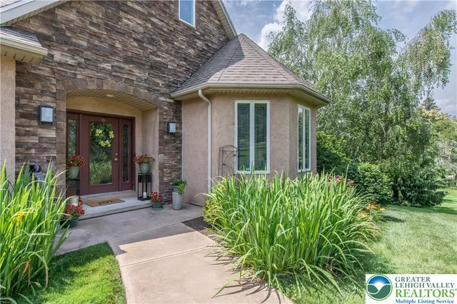 a view of a livingroom with furniture window and wooden floor