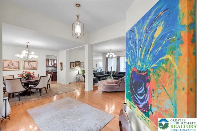 a view of a dining room with furniture and chandelier