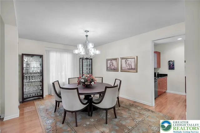 a kitchen with stainless steel appliances kitchen island granite countertop a refrigerator and a stove top oven