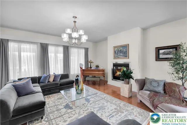 a kitchen with stainless steel appliances granite countertop a sink a refrigerator and a stove