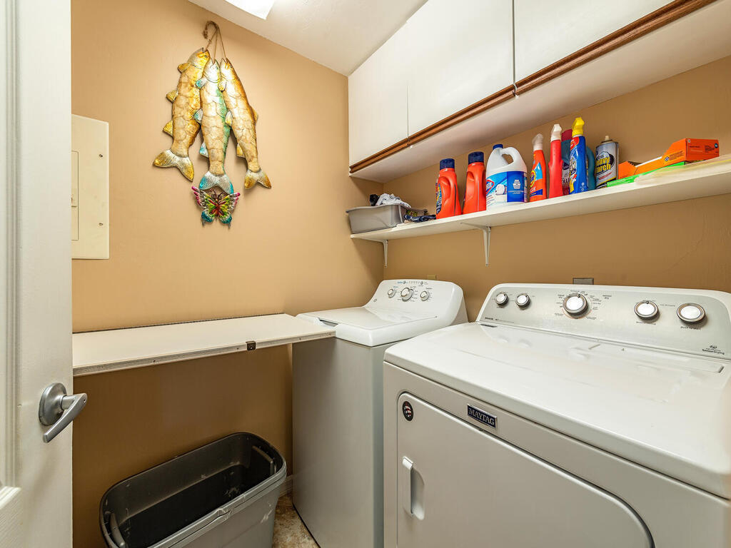 205 Deerwood Circle Naples, FL 34113 - Photo 11 of 12 a utility room with dryer and washer