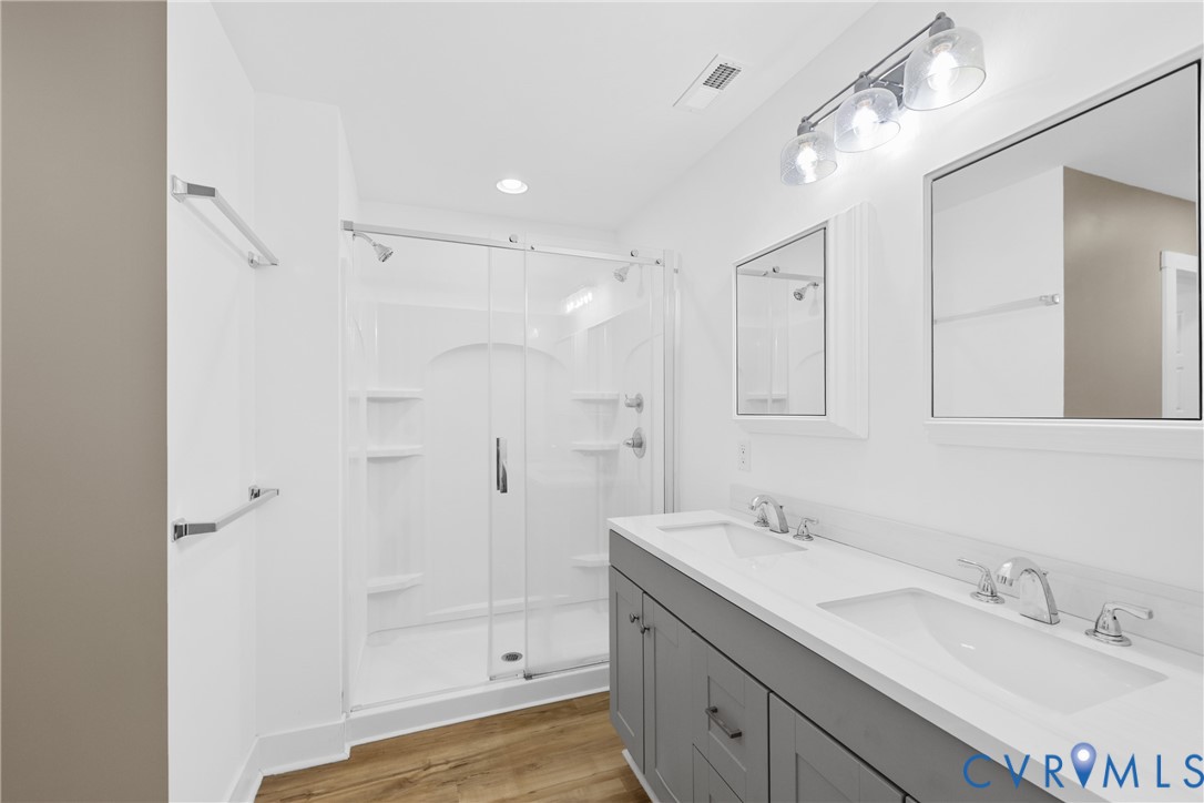 11905 Quaker Road Dinwiddie, VA 23841 - Photo 20 of 34 Dual vanity with integrated sinks, wood-finish flo