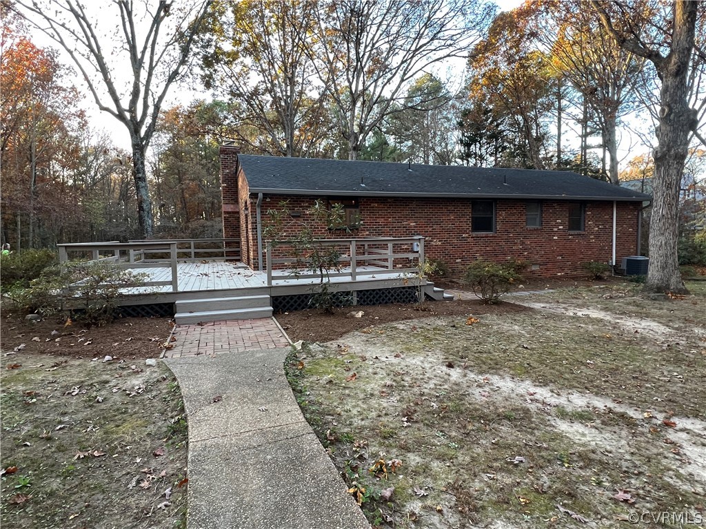 11434 Pinhook Road Rockville, VA 23146 - Photo 33 of 35 Back view of home and large deck with concrete sidewalk to the workshop