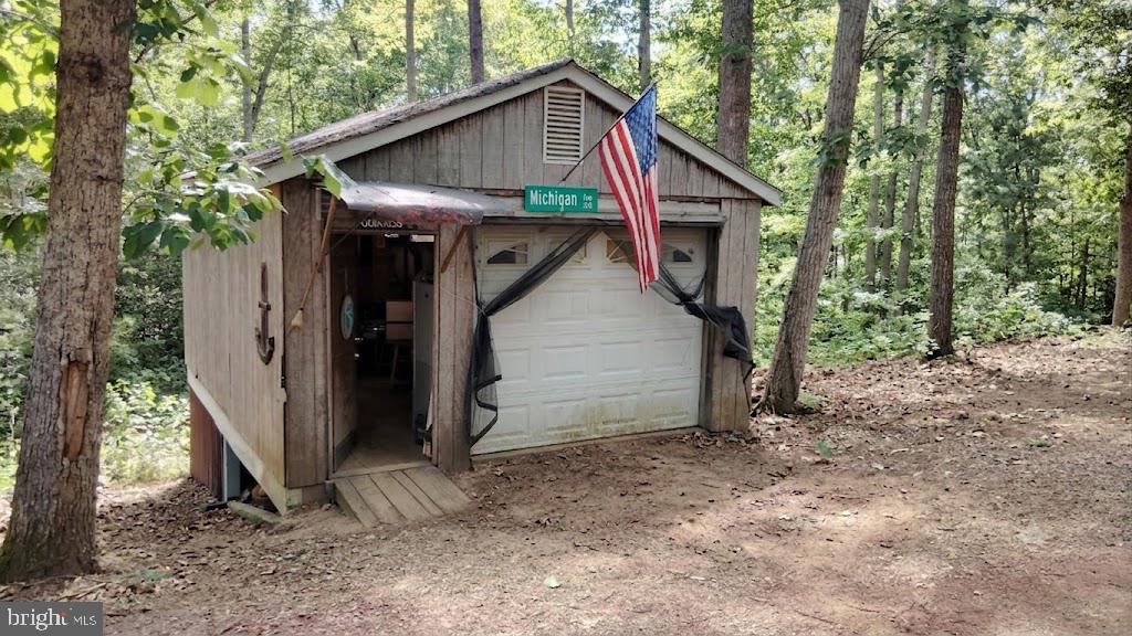 13025 Thunder Road King George, VA 22485 - Photo 10 of 34 Charming shed nestled in the woods.