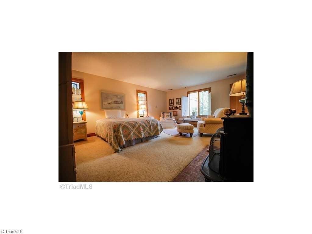 5078 Bunch Road Summerfield, NC 27358 - Photo 13 of 17 Large Master bedroom with wood stove.