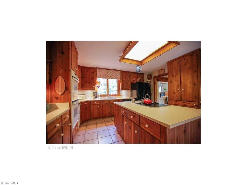 5078 Bunch Road Summerfield, NC 27358 - Photo 7 of 17 Kitchen, seller is willing to replace with Granite counters before closing