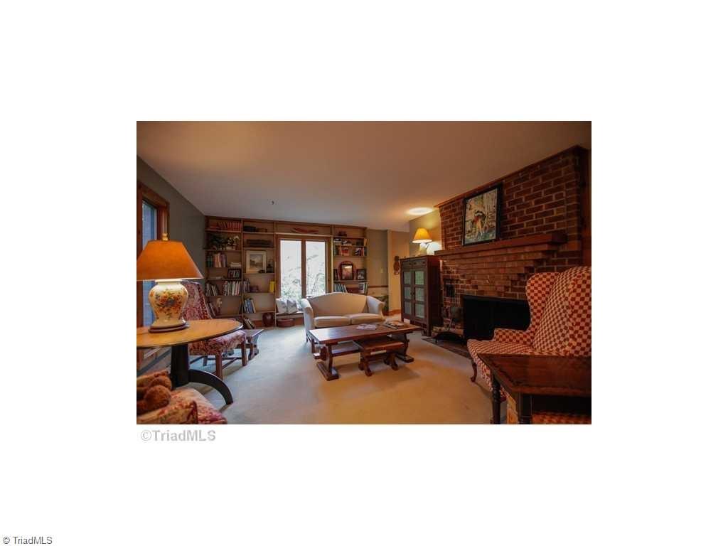 5078 Bunch Road Summerfield, NC 27358 - Photo 10 of 17 Den with wood burning fireplace