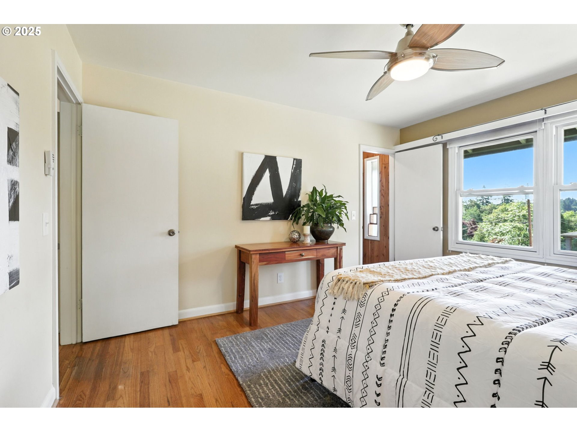 7149 Southwest 3rd Avenue Portland, OR 97219 - Photo 16 of 42 a bedroom with a bed window and a table