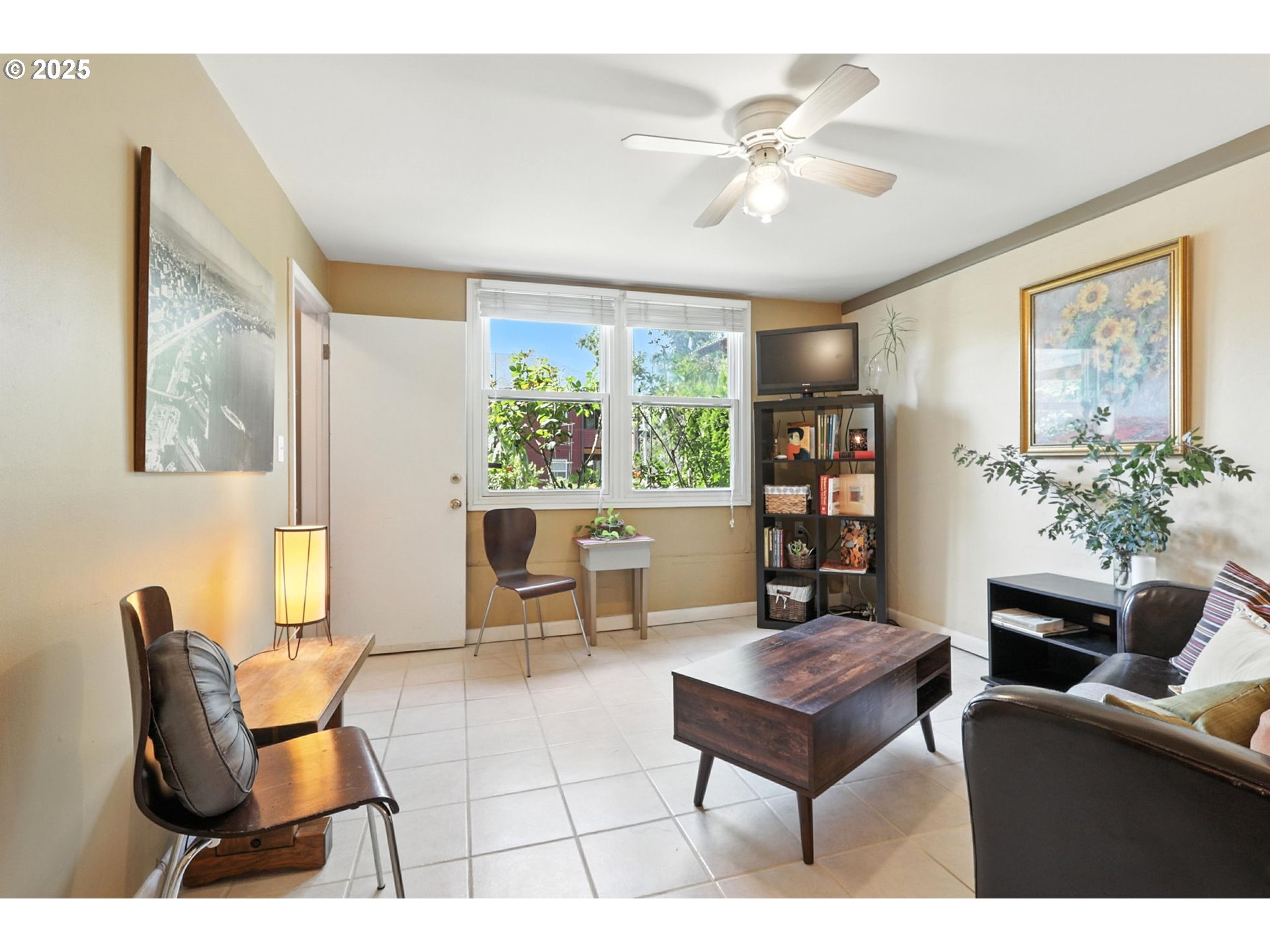 7149 Southwest 3rd Avenue Portland, OR 97219 - Photo 22 of 42 a living room with furniture and a potted plant