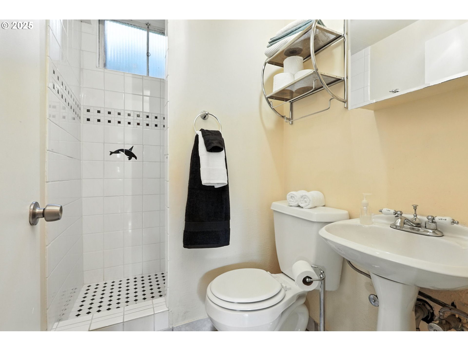 7149 Southwest 3rd Avenue Portland, OR 97219 - Photo 27 of 42 a bathroom with a sink toilet and shower