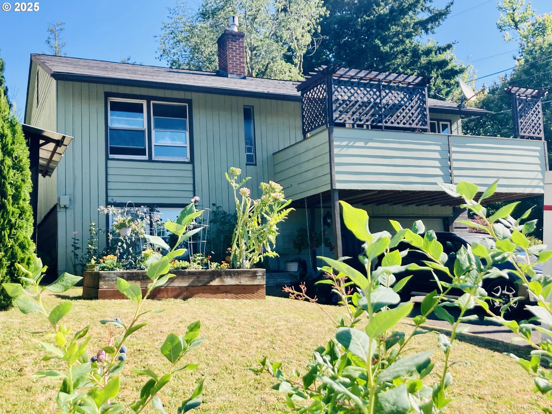7149 Southwest 3rd Avenue Portland, OR 97219 - Photo 31 of 42 a potted plant sitting in front of a house