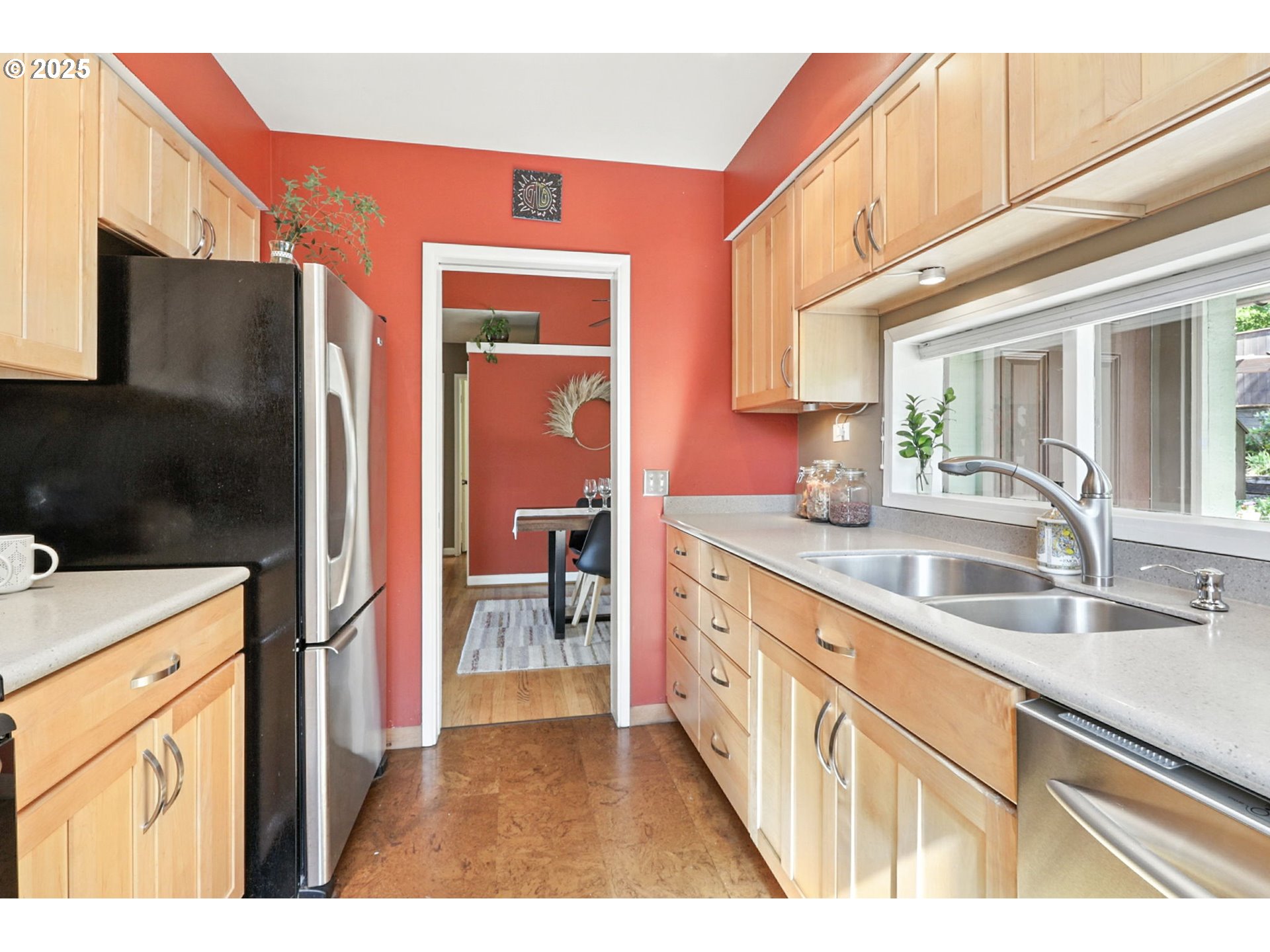 7149 Southwest 3rd Avenue Portland, OR 97219 - Photo 7 of 42 a kitchen view with stainless steel appliances granite countertop a refrigerator and a sink
