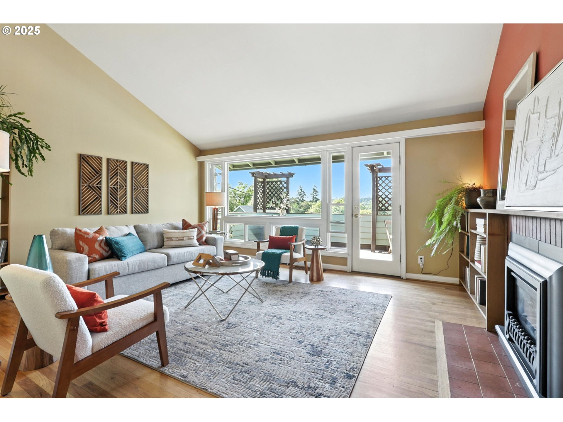 7149 Southwest 3rd Avenue Portland, OR 97219 - Photo 8 of 42 a living room with furniture and a fireplace