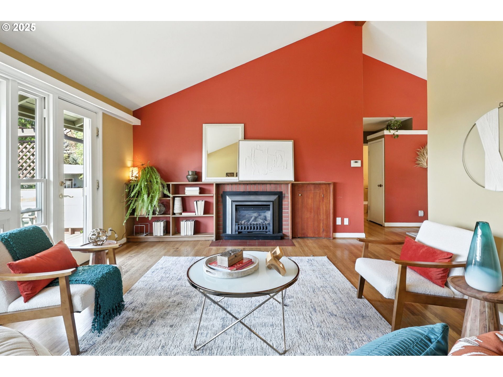 7149 Southwest 3rd Avenue Portland, OR 97219 - Photo 10 of 42 a living room with furniture and a fireplace