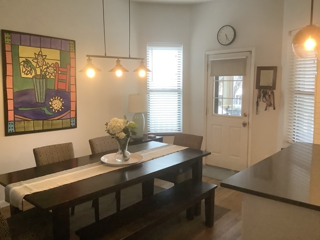 5216 North Kenmore Avenue, Unit 3S Chicago, IL 60640 - Photo 11 of 16 a dining room with furniture and window