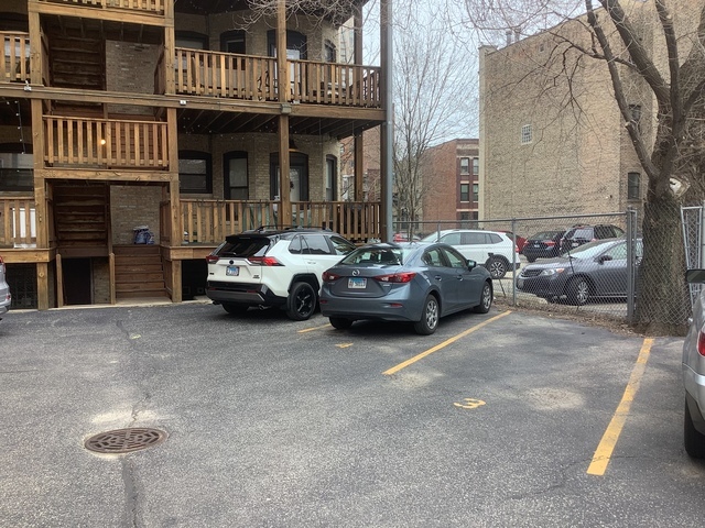 5216 North Kenmore Avenue, Unit 3S Chicago, IL 60640 - Photo 16 of 16 a cars parked in front of a brick building