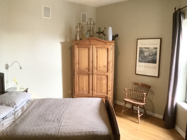 5216 North Kenmore Avenue, Unit 3S Chicago, IL 60640 - Photo 5 of 16 a bedroom with a bed and wooden floor