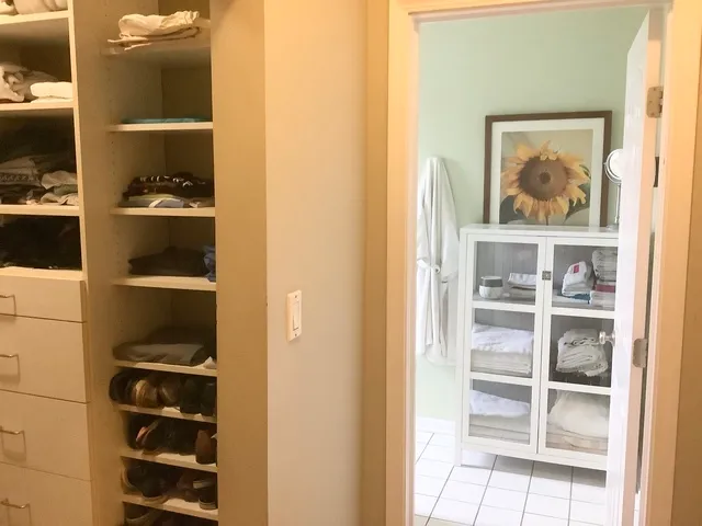 a view of a hallway with closet